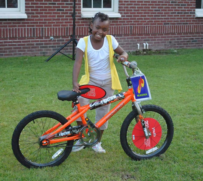 Georana Gainey, 10, had the first number drawn and chose the boy's bicycle donated by the Bluffton Target store for Hardeeville's annual National Night Out celebrations.