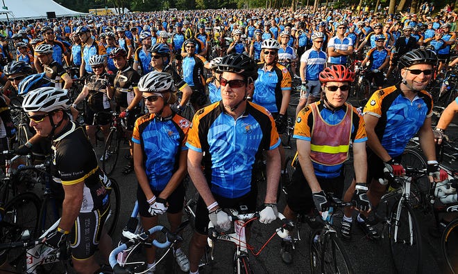 Pan-Mass Challenge cyclists pack the start area at Babson College in Wellesley Saturday morning.