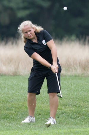 Jackson's Louisa Engelhardt chips a shot onto the green at Turkeyfoot Lake Golf Course.