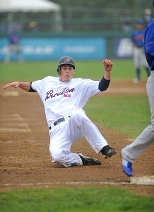 Brockton Rox outfielder Chris Valencia (11) steals third base during the game against the Rockland Boulders at Campanelli Stadium in Brockton on Sunday, August 7, 2011.