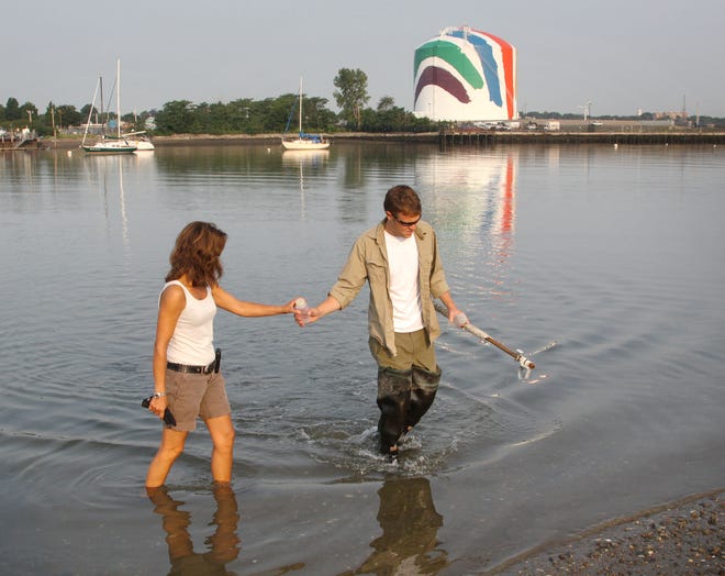 Professor Anamarija Frankic of Squantum works with Chris Schillaci of the Division of Marine Fisheries, taking water samples in Quincy Bay, Wednesday, July 20, 2011.