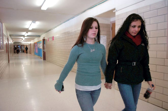 Brandi Cabral and Analia Rodriguez head to English at Northshore Recovery High School in Beverly on Feb. 24, 2011.