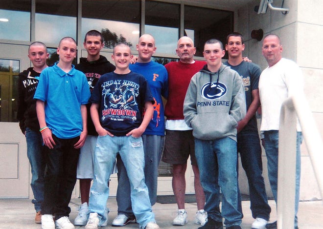Friends of Nick Watson of Avon have shaved their heads as the young man receives treatment for lymphoma. From left, they are Evan Stimpson, Cody Leroux, Ronnie Murrey, Sean Gallagher, Nick Watson, Gary Watson, Eric Bournaisian, Kenney DiEntremont, John Leroux.
