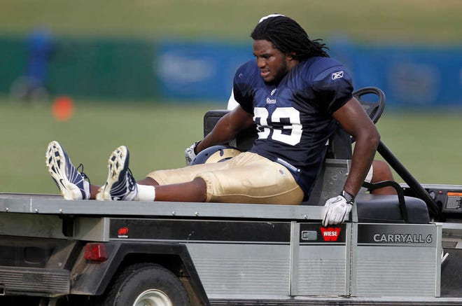 FILE - This Aug. 5, 2011, file photo, shows St. Louis Rams cornerback Jerome Murphy being taken off the field on a cart after being injured during NFL football training camp, in St. Louis. Every time someone gets banged up during camp, it begs the question: Is the NFL lockout to blame?(AP Photo/Jeff Roberson, File)