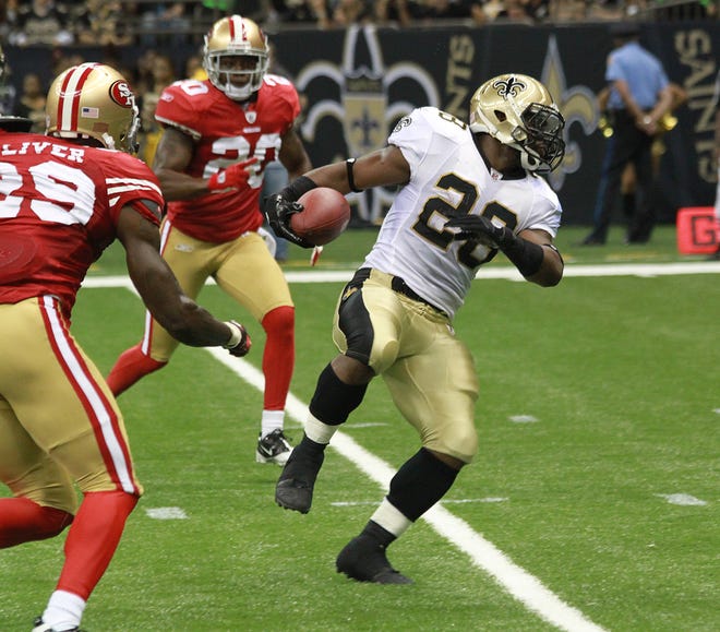New Orleans Saints running back Mark Ingram spins toward the end zone on a touchdown run.