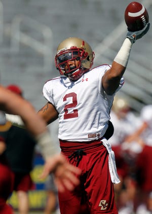 Boston College running back Montel Harris looks to pass during last month's team practice in Boston.