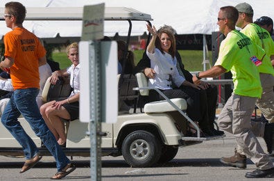 Michele Bachmann and her husband, Marcus, greeted voters during the poll on Saturday.