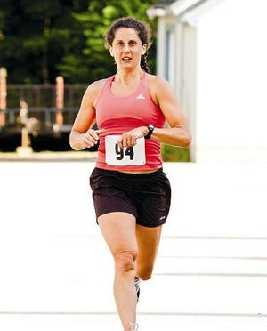 Cody Smith/Portsmouth Herald photo
Durham's Nicole Toye was the women's winner of the Lamprey Health Care 5K in Newmarket on Saturday.