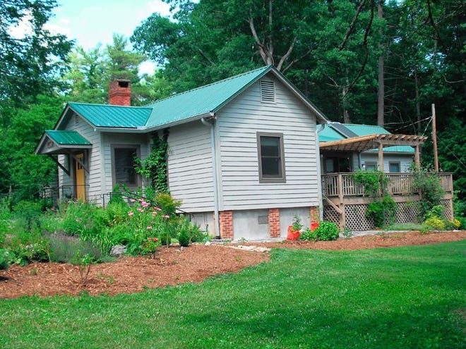 The Jones home, a 101-year-old house in Flat Rock, features a retractable clotheslines, native plants, herbs and fruit
trees. It will be featured on the ECO home tour Aug. 20.