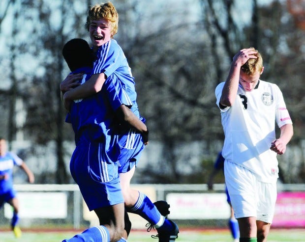 BCCS soccer player Sam Dickson gets a lift from teammate Abel
Carleton after Dickson scored a goal against Mercyhurst Prep during
the PIAA Class A boys soccer quarterfinal on Nov. 13, 2010. Dickson
collapsed during a break between practice sessions Monday at BCCS
and died.