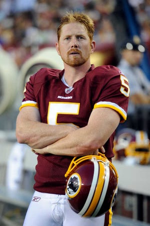 Washington Redskins place kicker Shayne Graham watches the action on the field from the sidelines during the first half of an NFL preseason football game against the Pittsburgh Steelers in Landover, Md., on Friday, Aug. 12, 2011. (AP Photo/Nick Wass)