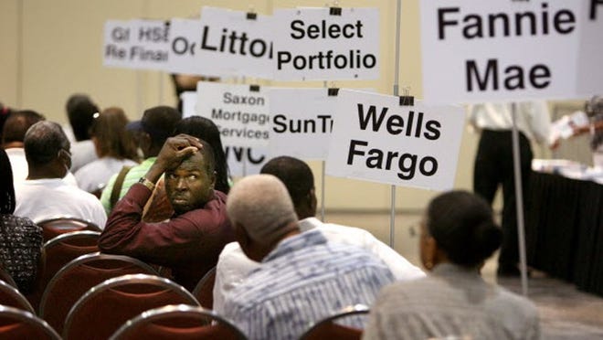 Kencel Louisius, of Lake Worth, is a homeowner looking for a loan modification at Hope Now on Friday, August 19, 2011.