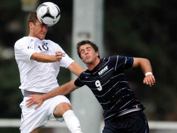 UNCW's Daniel Roberts (left) battles North Florida's Nick May on Saturday during an exhibition at UNCW.