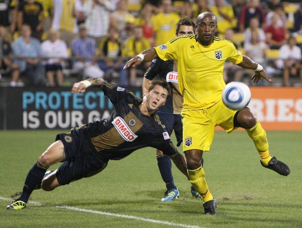 Emilio Renteria of the Crew gets past Union defender Danny Califf to score the Crew's first goal in the 37th minute.