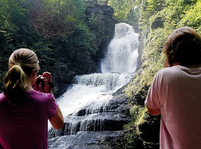 Photo by Daniel Freel/New Jersey Herald 
Marissa Sarna-McCarthy, 14, left, and her mother, Melanie Sarna, both of South Hampton, Mass., film a waterfall during a guided tour at Dingmans Falls, Pa., in the Delaware Water Gap National Recreation Area Sunday.