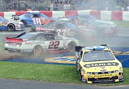 Marcos Ambrose, bottom right, goes off the track after crashing with Jacques Villeneuve (22) during Saturday's NASCAR Nationwide race in Montreal.AP Photo/The Canadian Press