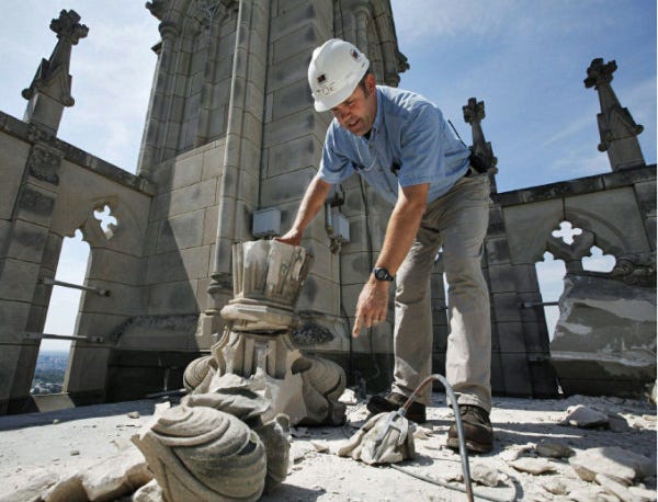 Joe Alonso, head mason at the Washington National Cathedral, tries to piece together a stone spire that fell during Tuesday's earthquake.