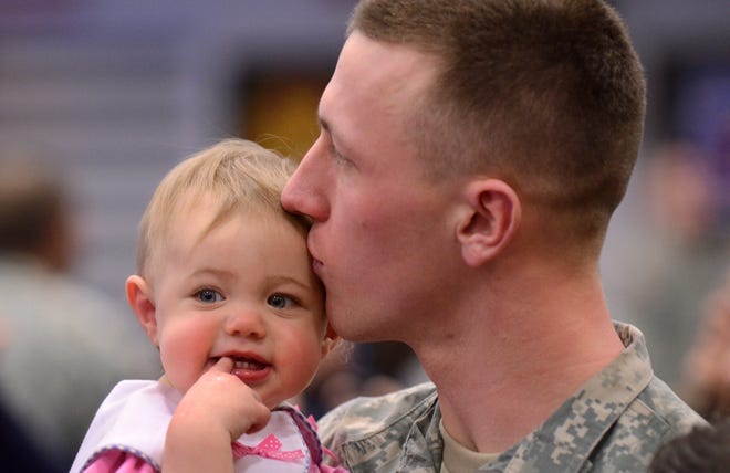 MANDATORY CREDIT: John Berry / The Post-Standard, Syracuse, NY


One-year-old Liberty Steele gets a kiss from her father, 1st Lt. Timothy Steele, following his unit's deployment ceremony held at Ft. Drum March 4, 2011. Steele and his fellow members of the 3rd Brigade Combat Team of the 10th Mountain Division were being deployed to Afghanistan for 12 months.