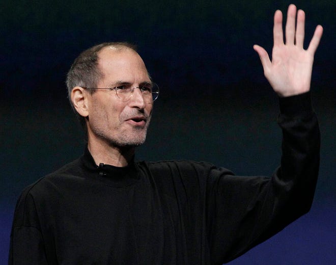 In this photo taken in March 2011, Apple Inc. Chairman and CEO Steve Jobs waves to his audience at an Apple event at the Yerba Buena Center for the Arts Theater in San Francisco. Apple Inc. on Wednesday, Aug. 24, 2011 said Jobs is resigning as CEO, effective immediately.