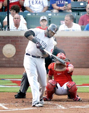 Boston Red Sox's David Ortiz connects for a solo home run as Texas Rangers catcher Yorvit Torrealba, rear, looks on in the second inning of a baseball game off a pitch from Rangers starter Alexi Ogando Thursday, Aug. 25, 2011, in Arlington, Texas. (AP Photo/Tony Gutierrez)
