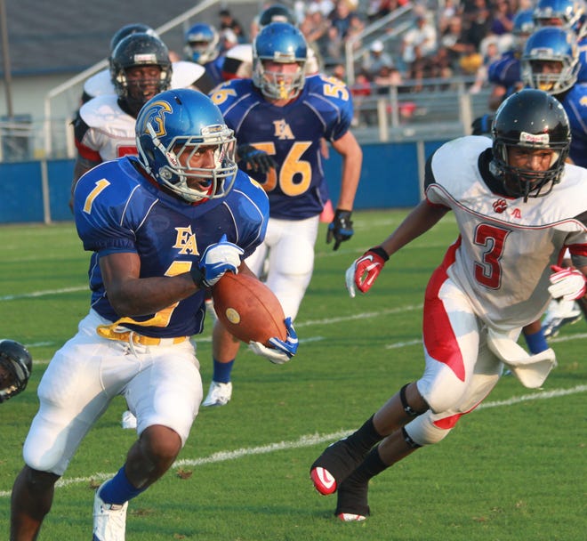 East Ascension's Chad Hill breaks away on a touchdown pass Friday night.