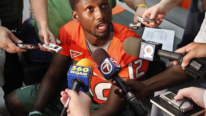Quarterback Jacory Harris takes questions from reporters during the University of Miami's Media Day in Coral Gables on Aug. 27, 2011.
