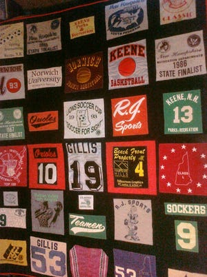 A memory quilt, made by the author's mother-in-law, comprised of the many athletic uniforms collected over the years.