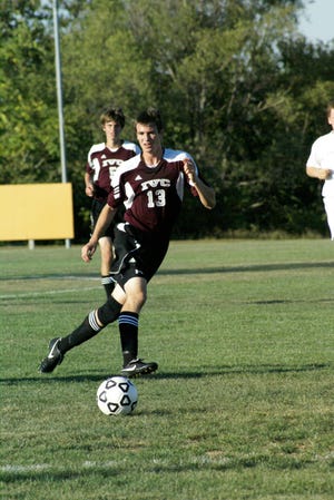 Connor Bogner chases the ball at East Peoria for the Grey Ghosts.