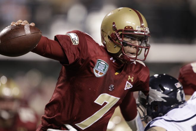 Boston College quarterback Chase Rettig (7) escapes pressure against Nevada during the first half of the Fight Hunger Bowl NCAA college football game in San Francisco, Sunday, Jan. 9, 2011.