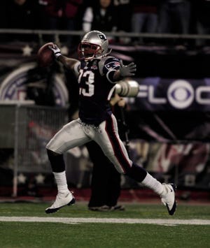 Leigh Bodden returns an interception for a touchdown against the Jets in Foxboro during a 2009 regular season game.