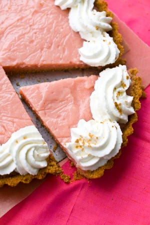Watermelon pudding tart served with plenty of whipped cream.