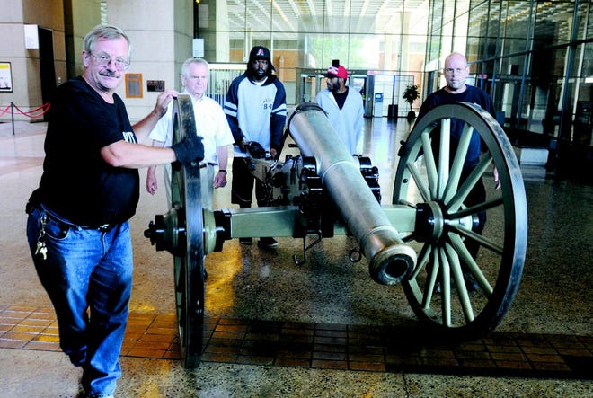 Escorting the Civil War cannon through the Great Court are (left to right) Daryl Sedlock, M.J. Albacete, Breyonn Edwards, Donti Townsley, and George Samay