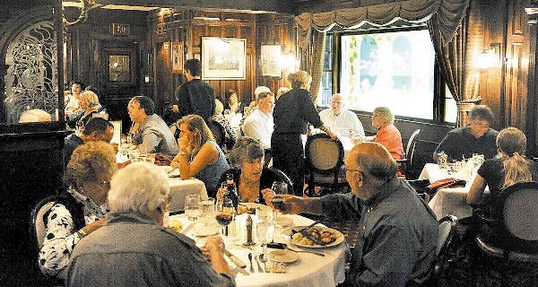 HYANNIS -- 08/26/11 --Diners take in the ambiances and food of The Paddock in Hyannis Friday evening.

HYANNIS -- 08/26/11 --Diners take in the ambiances and food of The Paddock in Hyannis Friday evening. 082611rs02
