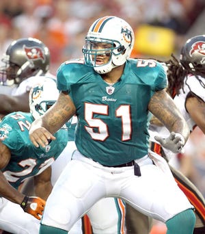 Miami Dolphins center Mike Pouncey, a former Lakeland Dreadnaught and University of Florida Gator, blocks during first-half action last Saturday at Raymond James Stadium in Tampa. (The Lakeland Ledger)