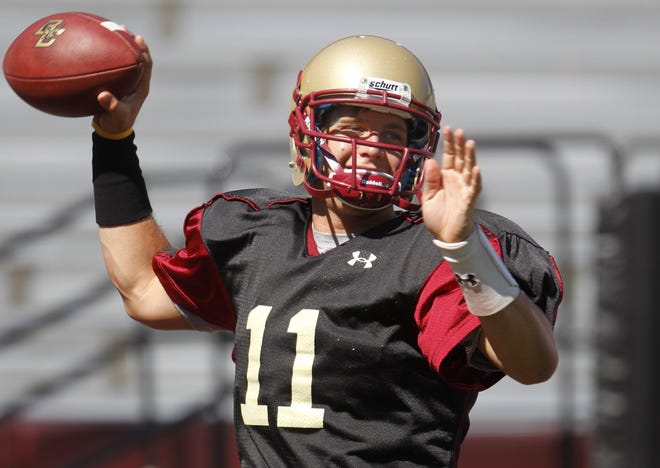 Boston College quarterback Chase Rettig looks to pass during an Eagles practice last week at Alumni Stadium.