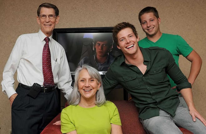 With an episode of the Showtime series "Weeds" running on screen, one of its stars, Hunter Parrish, third from left, poses with his aunt and uncle, Jim and Nancy Parrish, and cousin Monte Parrish in a suite at the Ramada Hotel and Convention Center.