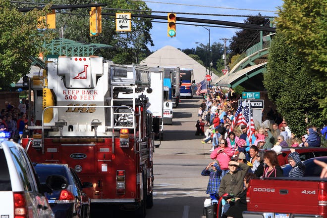 Trucks make their way into the Holland Farmer's Market in downtown Saturday during the annual Holland/Zeeland Community Labor Day Truck Parade.