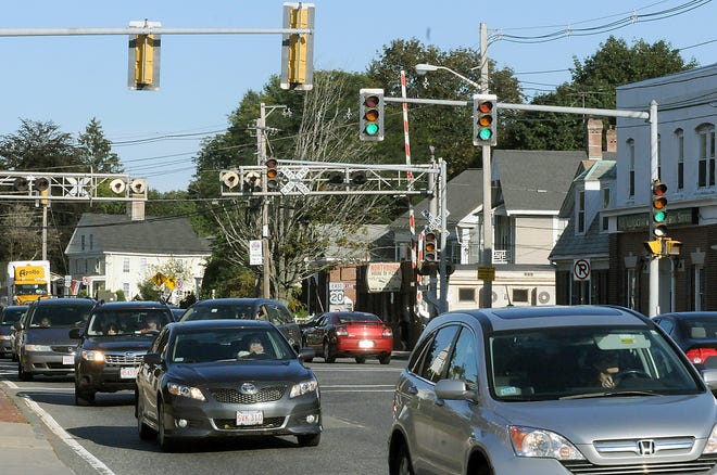 Cars drive along Rte. 20 in downtown Northborough last week. The state Department of Transportation is planning an 18-month roadwork project from Church to Hudson streets. Work begins in the spring.