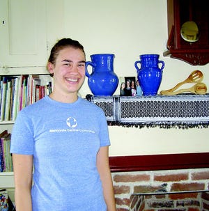 Joanna Hoover brought back souvenirs from her year in Iraq. The pots were handmade and the scarf is traditional to the Kurdish tribe.