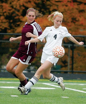 Photo by Daniel Freel/New Jersey Herald 
 
 Hackettstown’s Amanda Aussems, right, returns for the Tigers.