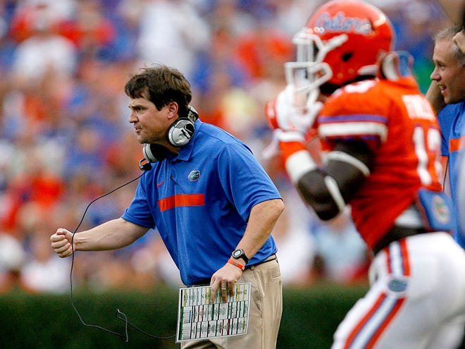 Florida coach Will Muschamp pumps his fist against the Florida Atlantic Owls during the first half at Ben Hill Griffin Stadium on Saturday. The Gators defeated the Owls 41-3.
