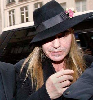In this Feb. 28, 2011 file photo, fashion designer John Galliano arrives at a police station in Paris. A Paris court on Thursday, Sept. 8, 2011 convicted former Christian Dior designer John Galliano for making anti-Semitic insults and gave him a suspended sentence of euro 6,000 ($8,400) in fines.
