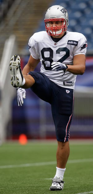 Newly aquired New England Patriots tight end Dan Gronkowski (82), brother of Patriots tight end Rob Gronkowski, stretches during NFL football practice in Foxborough, Mass., Wednesday, Sept. 7, 2011. The Patriots open their season against the Miami Dolphins in Miami on Monday night, Sept. 12. (AP Photo/Stephan Savoia)