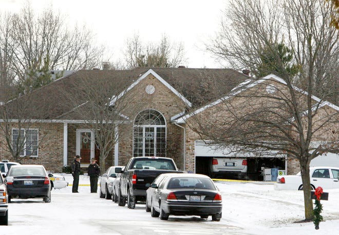 Illinois State Police officers stand outside the home of Springfield Mayor Tim Davlin at 2604 Apple Creek Drive in Springfield, Ill. Tuesday, Dec. 14, 2010. Davlin, 53, was found dead in the house early Tuesday, reportedly from an apparent self-inflicted gunshot wound, but authorities would not confirm that at a news conference this morning. Justin L. Fowler/The State Journal-Register