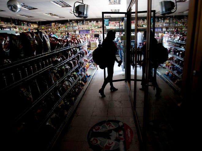 Deborah Springs shops in a convenience store for food items after a power outage Thursday, Sept. 8, 2011, in San Diego. A power outage is affecting millions of people across southern California, Arizona and Mexico. San Diego Gas & Electric Co. Darcel Hulce said that crews Thursday believe the outage was caused by a system breakdown and assured people it was not the result of a terror attack. (The Associated Press)