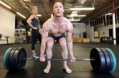 Lisa Twight, an owner of Gym Jones in Salt Lake City, watched Robert MacDonald, the gym’s manager, work out.