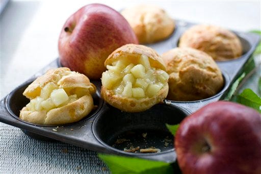 Photo shows apple cheddar puffs. With the onset of apple season, it's time to start thinking about ways to use up all those bushels you bring home from your picking adventures. (AP Photo/Matthew Mead)