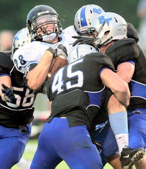 The Bartram Trail defense wraps up Ponte Vedra All-County running back Cole Mazza.