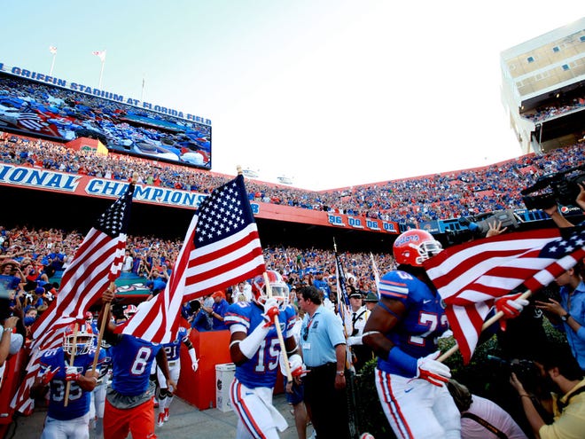 Th Florida Gators run onto the field with American Flags against the University of Alabama Birmingham Blazers during the first half at Ben Hill Griffin Stadium on Saturday, Sept. 10, 2011 in Gainesville, Fla.