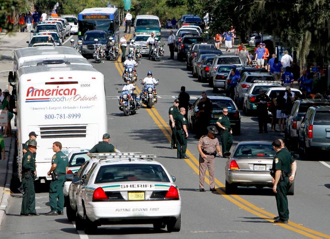 Officers fill the street outside Ben Hill Griffin Stadium before the Florida Gators versus the University of Alabama Birmingham Blazers game on Saturday in Gainesville.